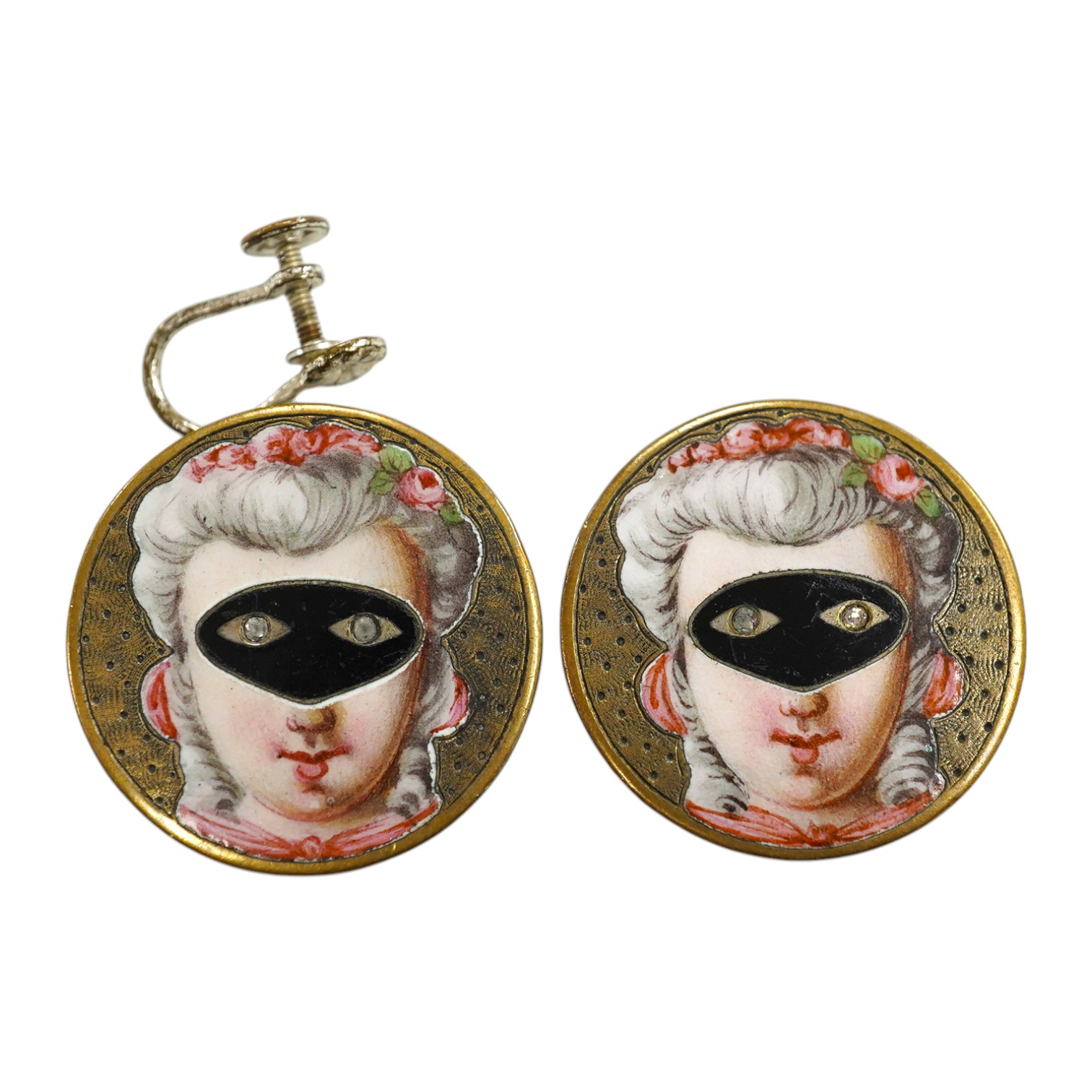 A pair of engraved gilt metal enamel and paste set disc shaped buttons)converted to earrings, one fitting missing), each decorated with a lady wearing a mask, diameter 25mm. Condition - poor to fair